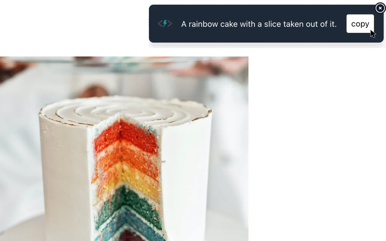 AltText.ai browser extension pop-up showing the alt text A rainbow cake with a slice taken out of it, with a copy button, above the cake photo it describes